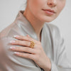Kiara gold plated everyday statement ring featuring a clustered bubble bead design worn by a model by Eda Jewels Dubai.